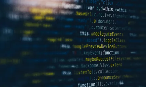 Multicoloured code script on a black screen