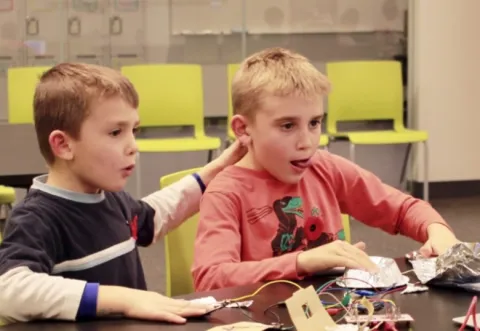 Two boys working with electronics Two boys working with electronics
