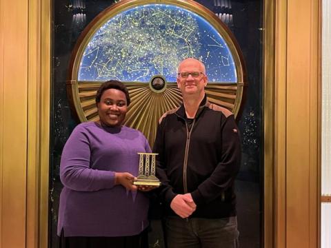 Bridge Prize 2022 winner Chido Muchemwa receives the Bridge Prize trophy from donor and ULethbridge alumnus Terry Whitehead