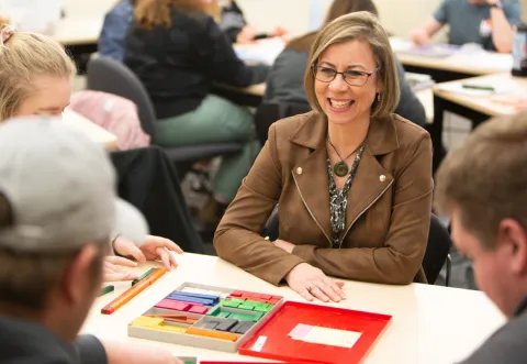 Teacher in a classroom setting Teacher in a classroom setting