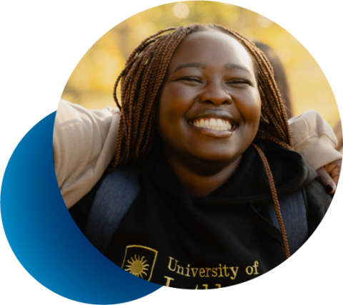 abstact circular frame showing smiling college girl with dark skin enjoying the outdoors
