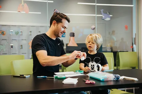 A teacher with a young student