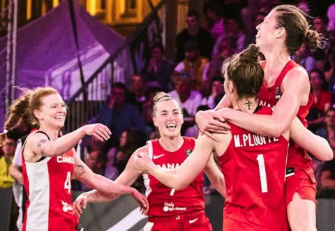 Basketball players celebrate