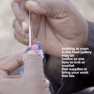 close up of hands crocheting.