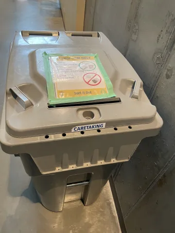 Image of a grey recycling bin