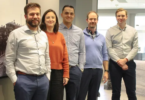 A photo of five individuals from Stringam Law standing together.