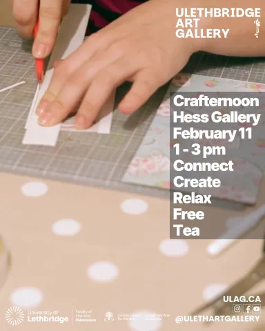 closeup of a hand cutting a piece of paper with an exacto knife.