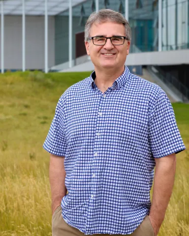 WAYNE LIPPA stands in front of ULethbridge