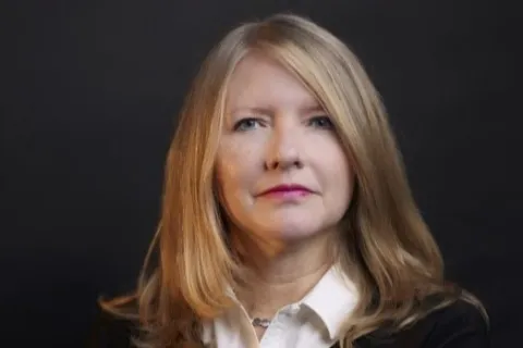 Woman in front of a white background