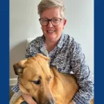 Josie and Tumble, a dog, blue background