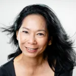 Photograph of Pat Lai Ngo Chan from the shoulders up.  She is a smiling woman with long black hair.