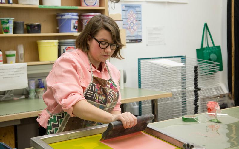 Student using silkscreen press