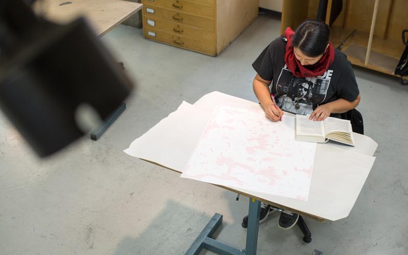 Student drawing in studio