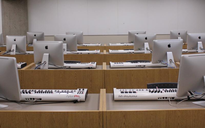 Lab of Mac computers and digital recording keyboards at each station