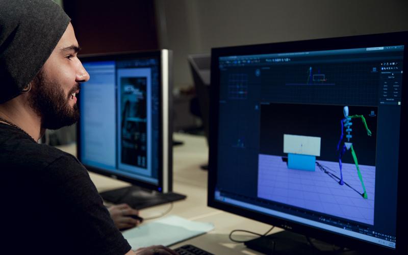 student 3d animating on computer station