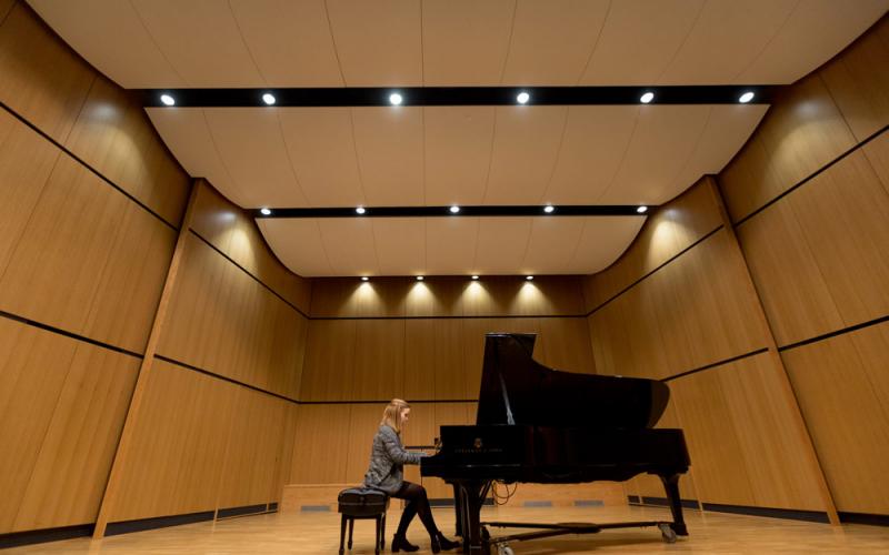 Recital hall stage with piano on it