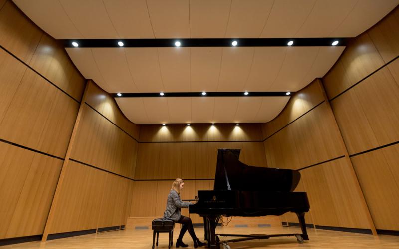 Recital hall stage with piano on it