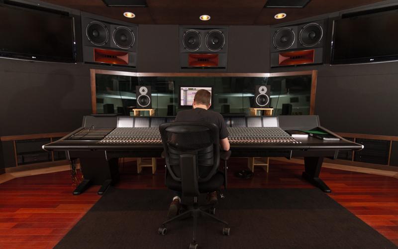 rear shot of student sitting at sound board