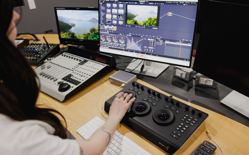Student in a cinema editing suite.