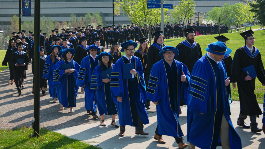 A traditional part of ULethbridge convocation ceremonies is the march of graduands and other dignitaries, led by the University piper.