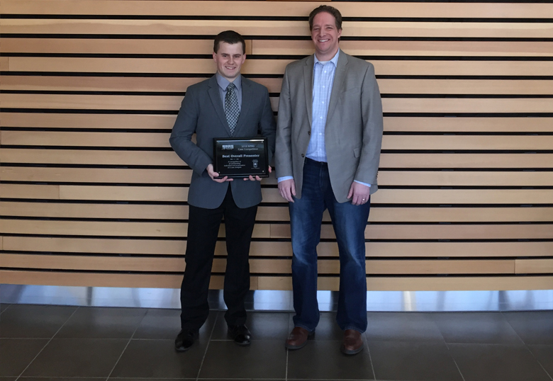 Sean Annis, at left, posed for a photo with Colin Miller, partner at KPMG. Annis received the Best Overall Presenter award.