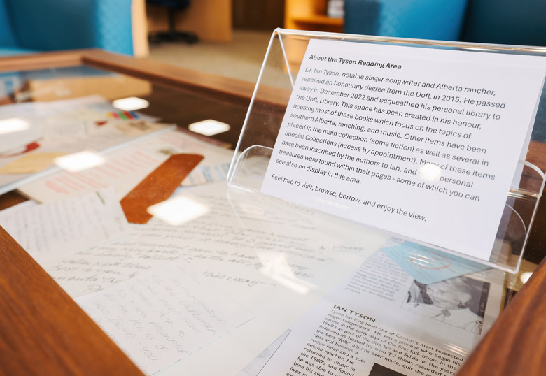 The Ian Tyson Reading Area features a table of memorabilia that includes notes, ticket stubs and awards letters from Tyson's collection.