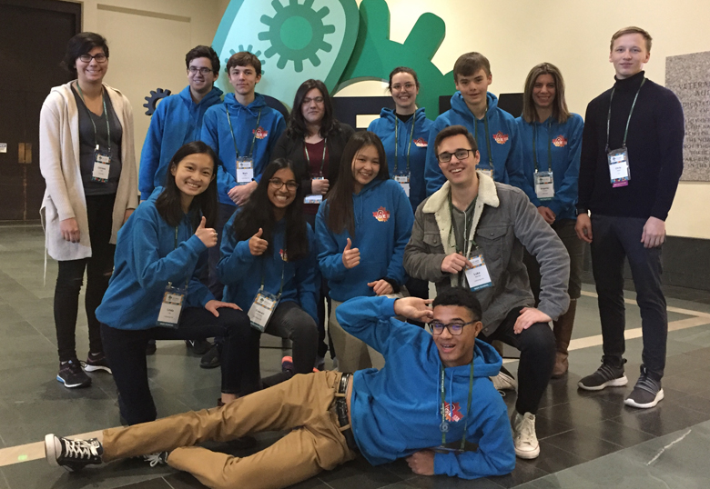 U of L iGEM collegiate and high school team members and their advisors in Boston. Back row (L–R) Catrione Lee, David Basil, Mark Lea, Dia Koupantsis, Laura Keffer-Wilkes, Thomas Byrne, Angeliki Pantazi and Chris Isaac. Middle (kneeling L–R) Linda He, Dewuni De Silva, Michelle Wu and Luke Saville. Front – Julien Todd.