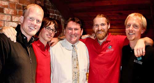 The late Dr. Rick Mrazek, centre, with Adam Kreek, far left, and members of his crew.
