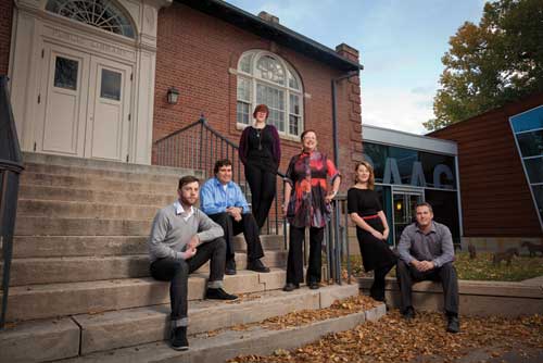 SAAG executive director Marilyn Smith, middle, is flanked by fellow U of L alumni and SAAG employees Tyler Stewart (far left), David Farstad, Jenn Prosser, Christina Cuthbertson and Ryan Doherty. Marilyn Smith