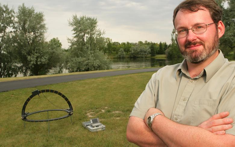Dr. Craig Coburn is an accomplished geographer in the Alberta Water and Environmental Science Building. Here he's pictured with a goniometer, an instrument that either measures an angle or allows an object to be rotated to a precise angular position.