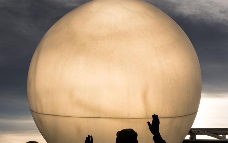 Filling the high-altitude balloon with helium prior to its dawn launch.