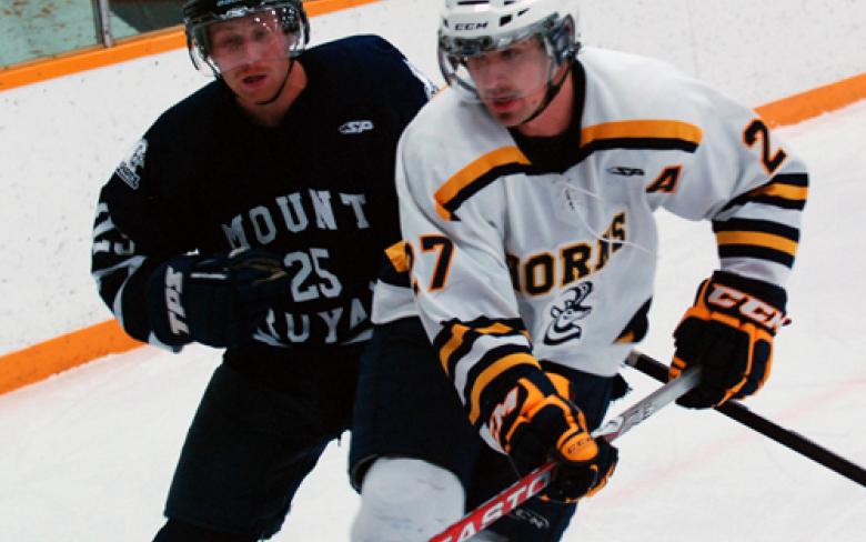 Horns defenseman Brent Henke wages a defensive zone battle with a Mount Royal University player during Canada West action.